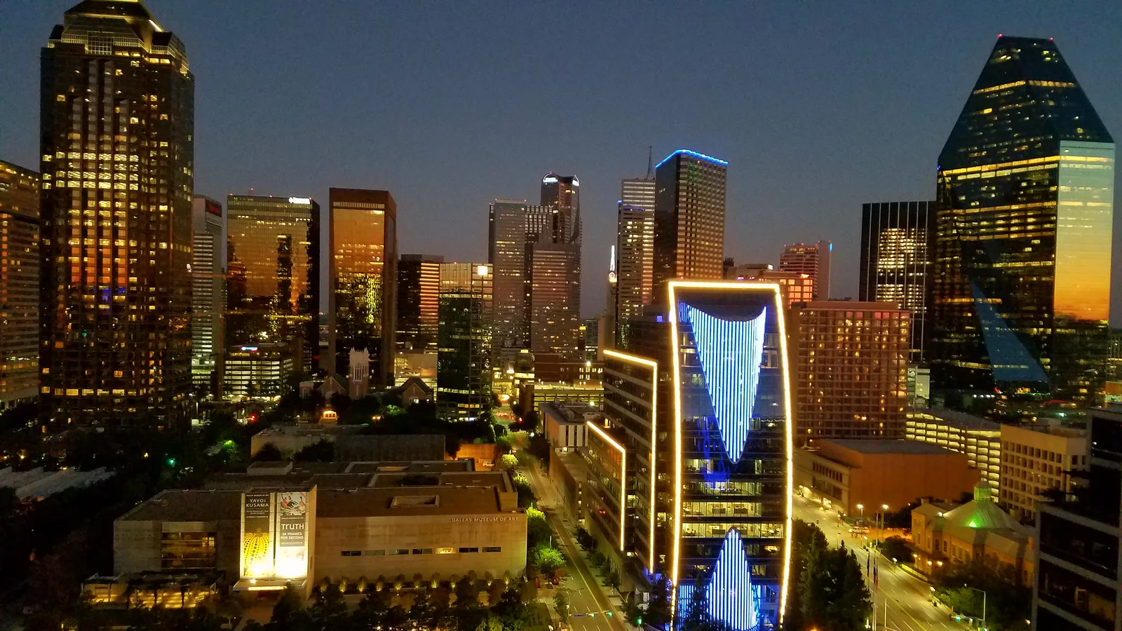 The Dallas Arts District and downtown buildings illuminated in the evening, photographed in 2017