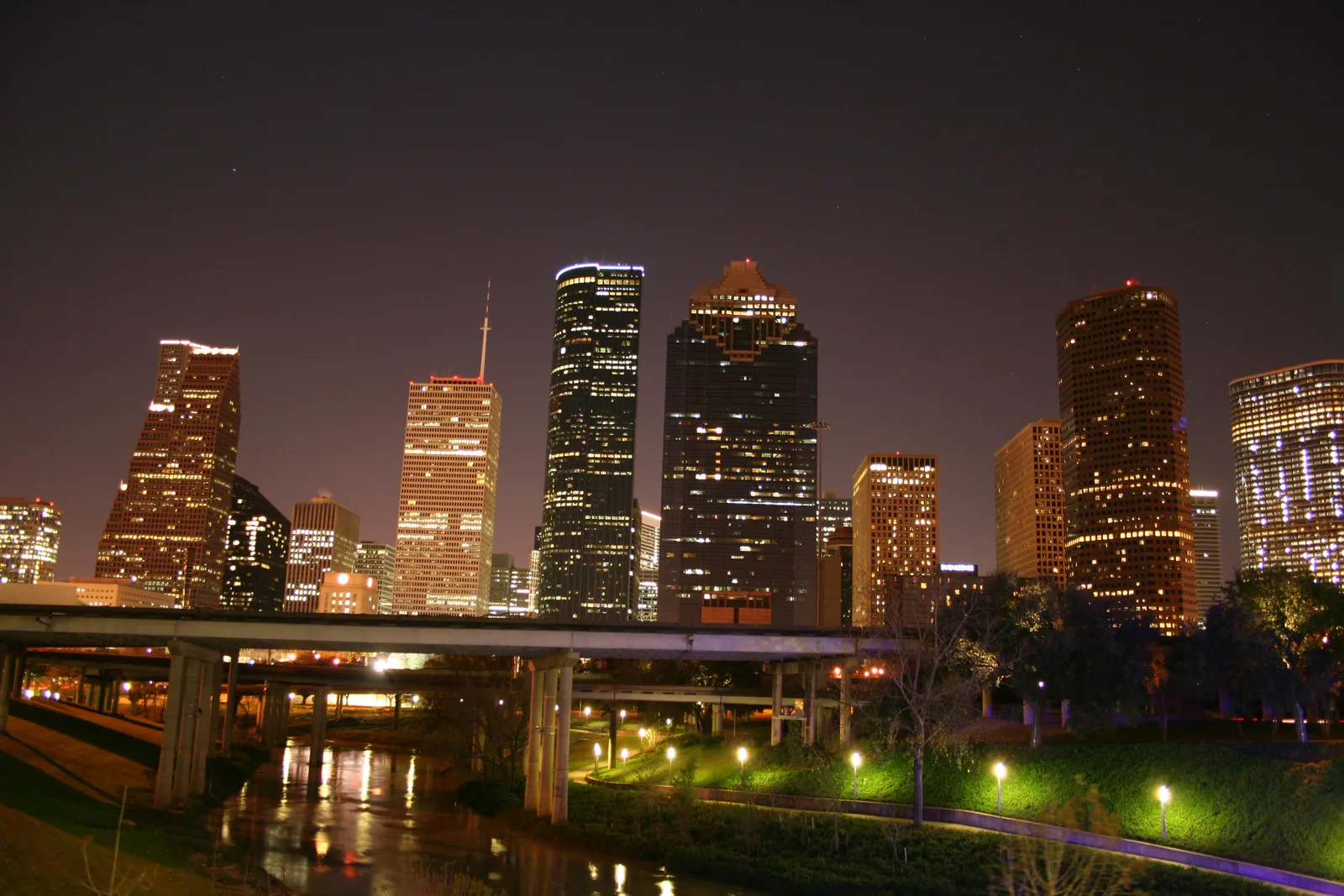 Downtown Houston buildings and Buffalo Bayou illuminated at night, photographed in 2008