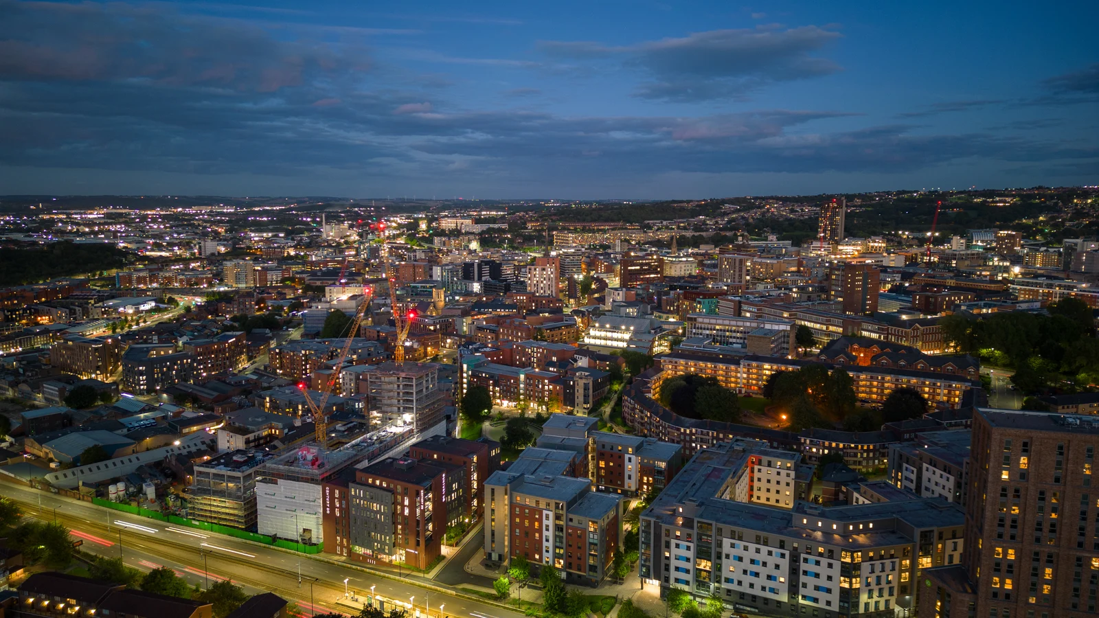 Sheffield city centre and skyline illuminated at dusk in September 2022