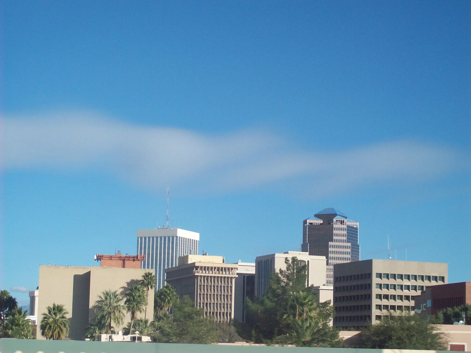 Downtown Tucson buildings beneath a blue sky in a historical city photograph